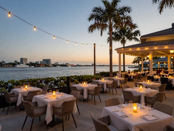 Elegant waterfront restaurant patio with string lights at dusk in Tampa for luxury sugar dating dates