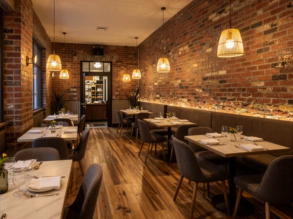 Upscale Pearl District restaurant interior with exposed brick and warm lighting for premium sugar dating dates